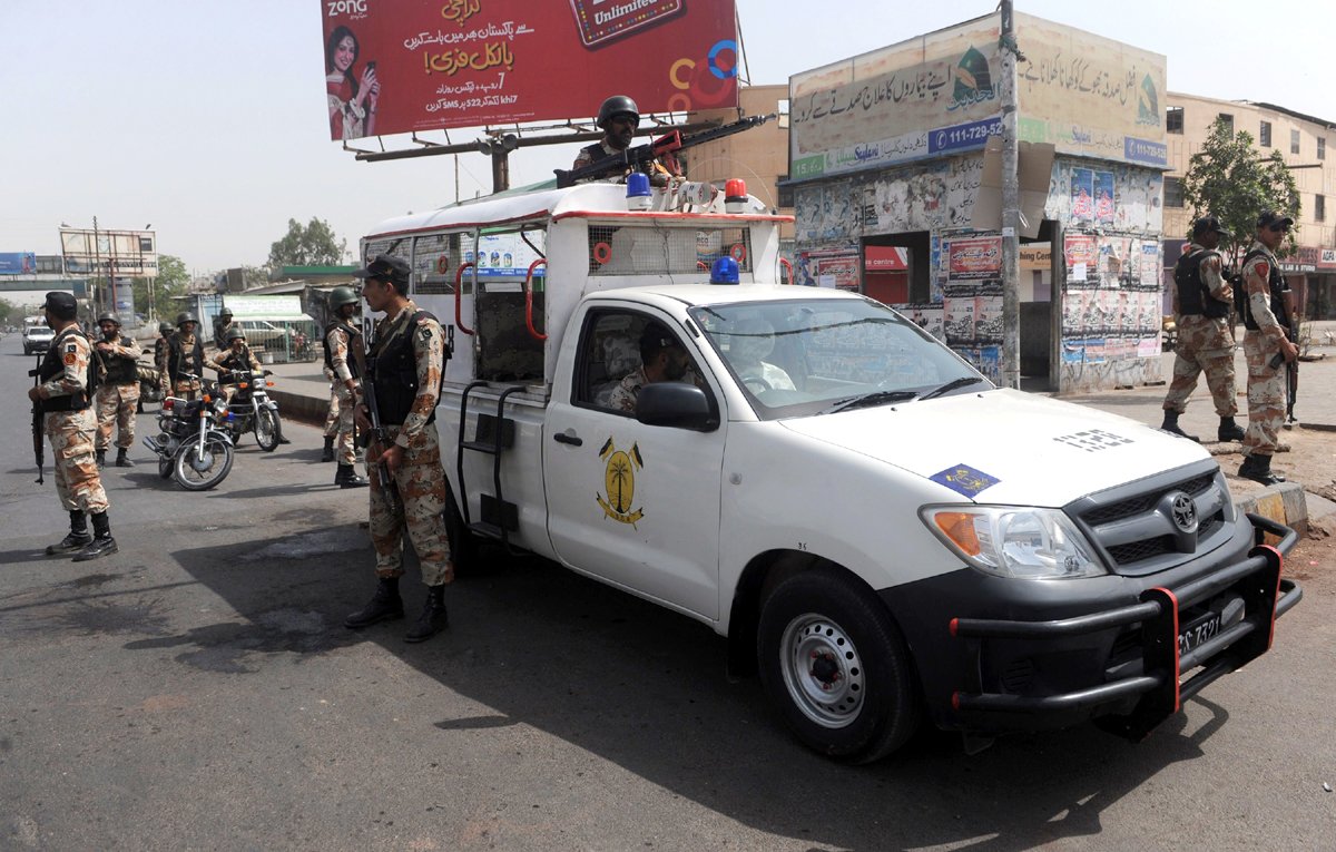 security forces conduct raid in the gulshan e buner area of landhi photo afp