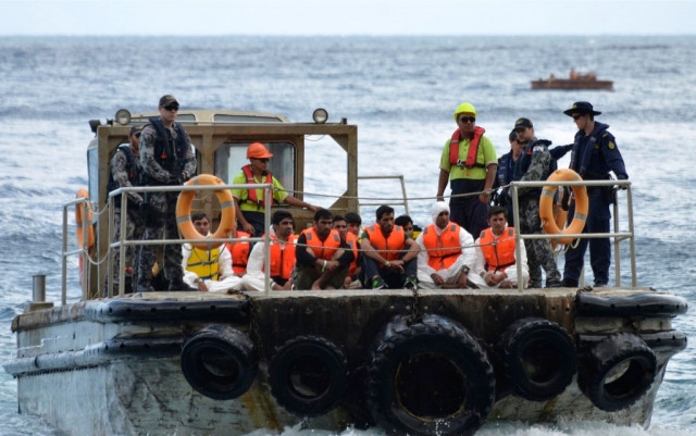 a file photo of a boat carrying asylum seekers photo reuters a file photo of a boat carrying asylum seekers photo reuters