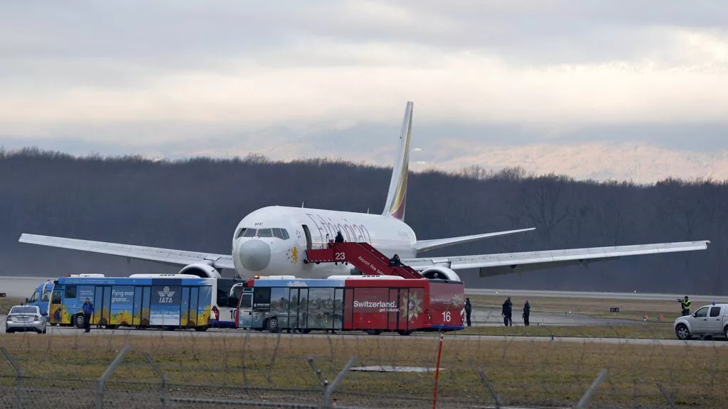 police evacuate passengers on february 17 2014 from the ethiopian airlines flight en route to rome which was on hijacked and forced to land in geneva where the hijacker has been arrested police said photo afp police evacuate passengers on february 17 2014 from the ethiopian airlines flight en route to rome which was on hijacked and forced to land in geneva where the hijacker has been arrested police said photo afp