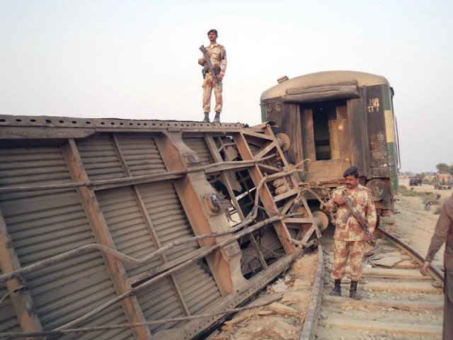 paramilitary soldiers guard the site where a passenger train derailed after a blast on a railway track in thull on sunday photo reuters paramilitary soldiers guard the site where a passenger train derailed after a blast on a railway track in thull on sunday photo reuters