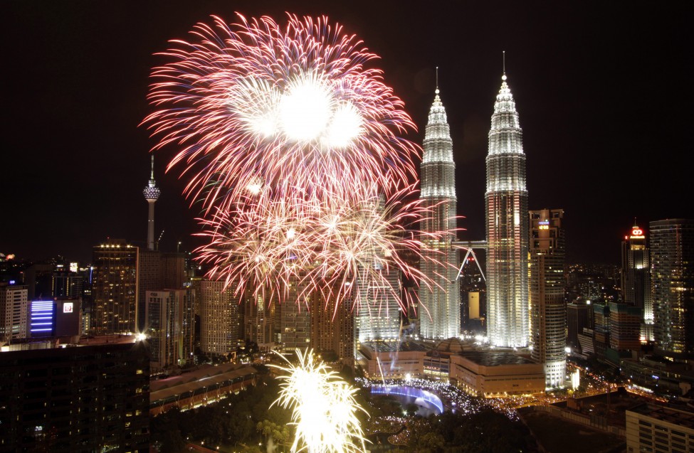 fireworks explode near malaysia s landmark petronas twin towers during new year celebrations in kuala lumpur photo reuters