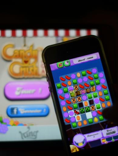 a man plays at candy crush saga on his iphone photo afp