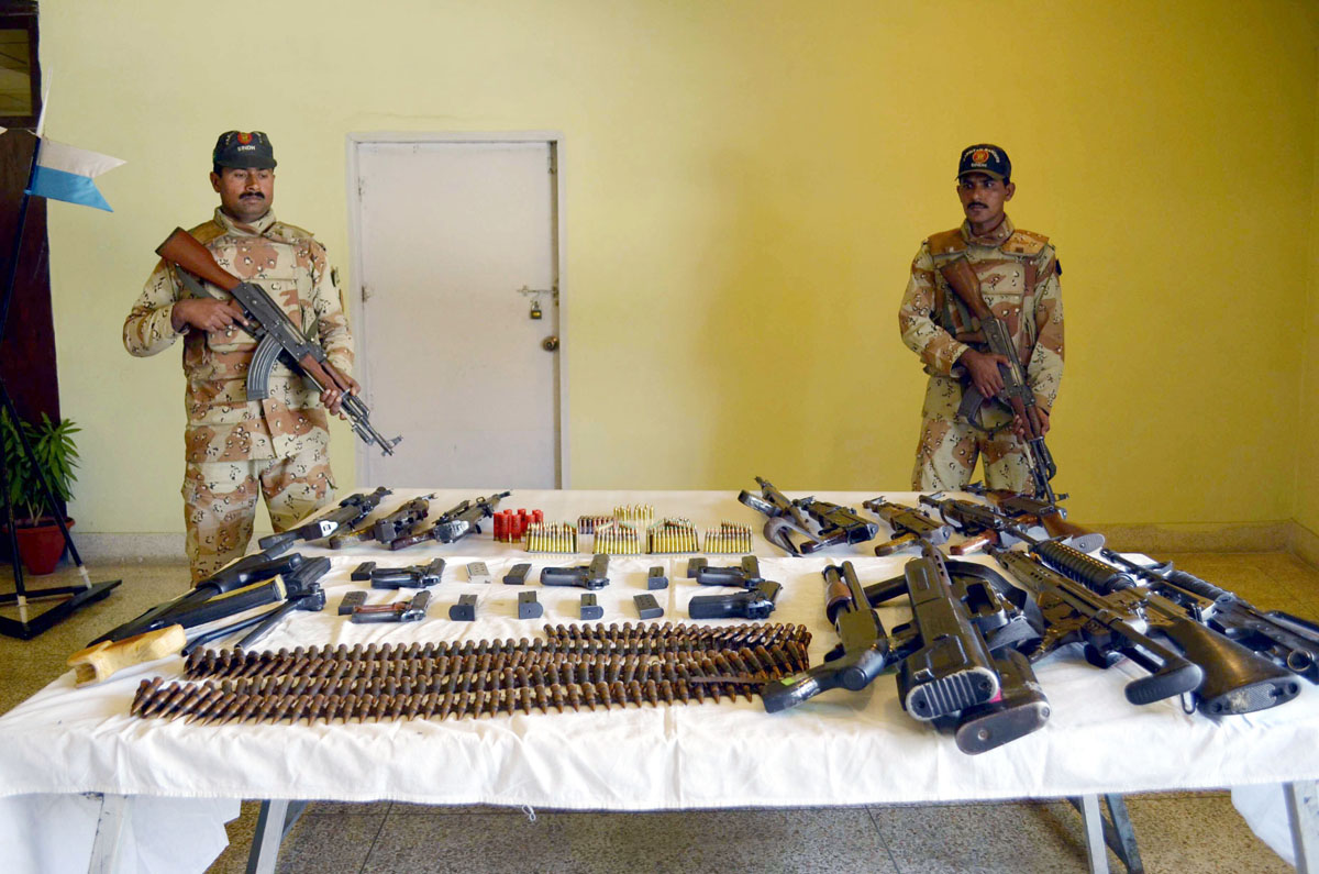 rangers personnel display the latest haul of weapons they claim to have recovered during security operations in karachi photo mohammad azeem express