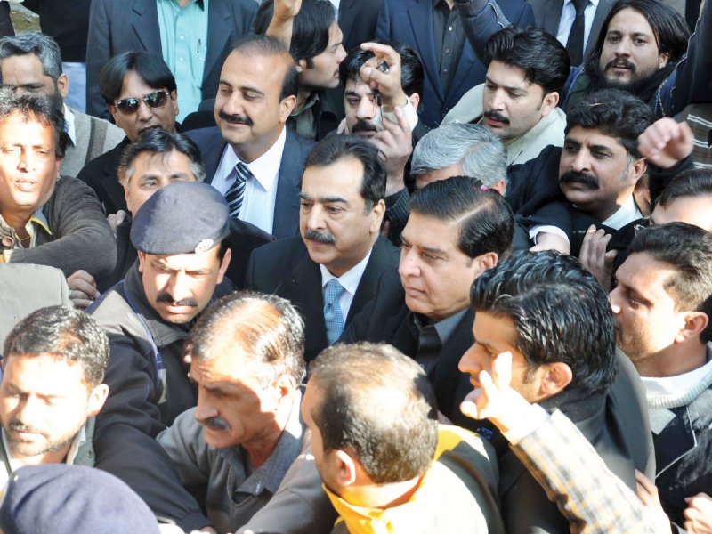 former prime ministers syed yousaf raza gilani and raja pervaiz ashraf arrive at an accountability court on tuesday photo muhammad javaid express