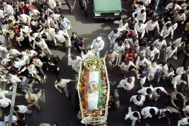 his photograph taken on may 24 1991 shows the funeral procession for slain prime minister rajiv gandhi moving through the crowded streets of new delhi photo afp file