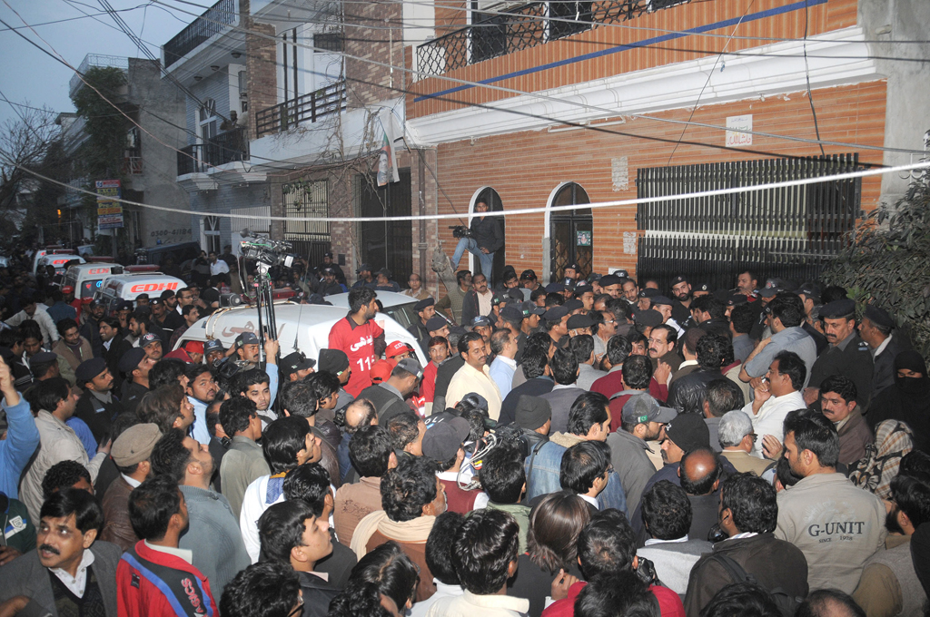 people gathered outside the house where eight members of a family were bludgeoned to death photo express tariq hasan