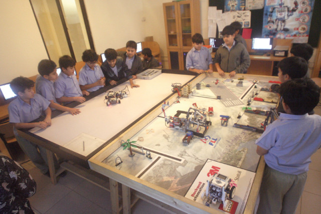 at the full of activity classrooms at haque academy students experiment in building the elementary form of lego based robots with inclusion of gears and motors the students employ their imagination and logic by means of scratch software developed by massachusetts institute of technology for young children to be able to programme with drag and drop blocks   to interact with the lego wedo kit photos athar khan express