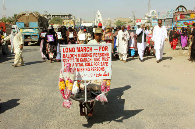 relatives of missing persons pass through a road during long march rally 21 11 2013 photo ppi relatives of missing persons pass through a road during long march rally 21 11 2013 photo ppi