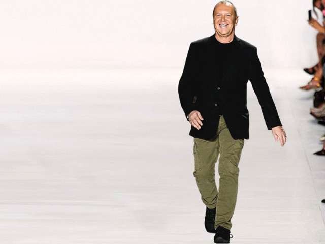designer michael kors launches his fall winter 2014 collection during new york fashion week photo file designer michael kors launches his fall winter 2014 collection during new york fashion week photo file