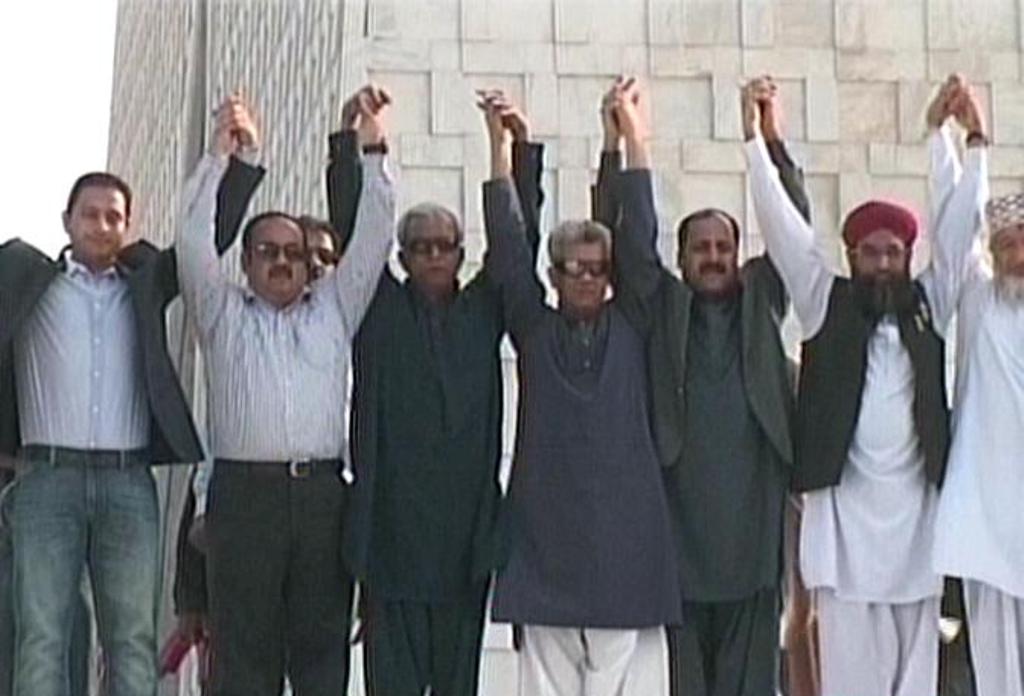 express news screengrab of political party members outside mazar e quaid
