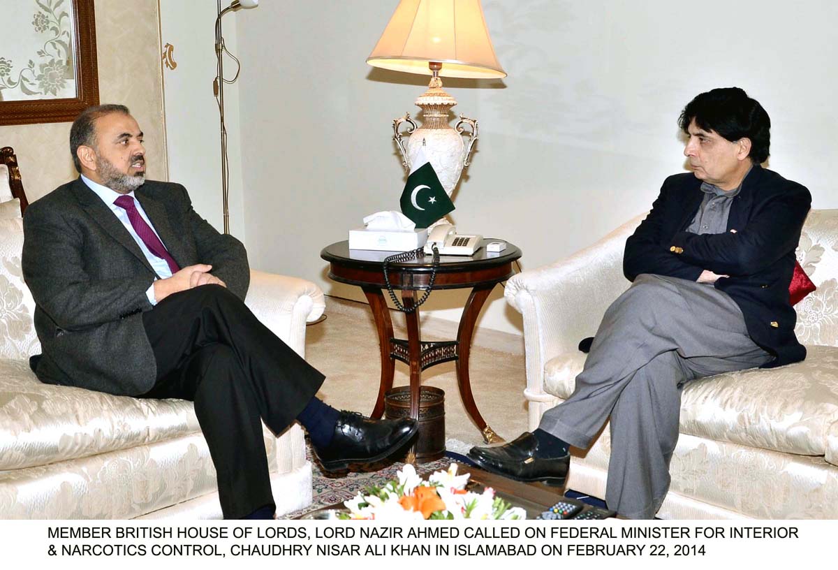 member of house of lords nazir ahmed l in a meeting with interior minister chaudhry nisar ali khan r photo pid