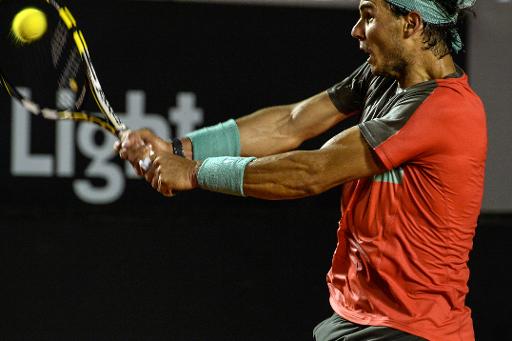 rafael nadal of spain hits a return against pablo andujar of spain during the 2014 rio open men 039 s semi final singles tennis match in rio de janeiro brazil on februrary 22 2014 nadal won by a 12 10 photo afp