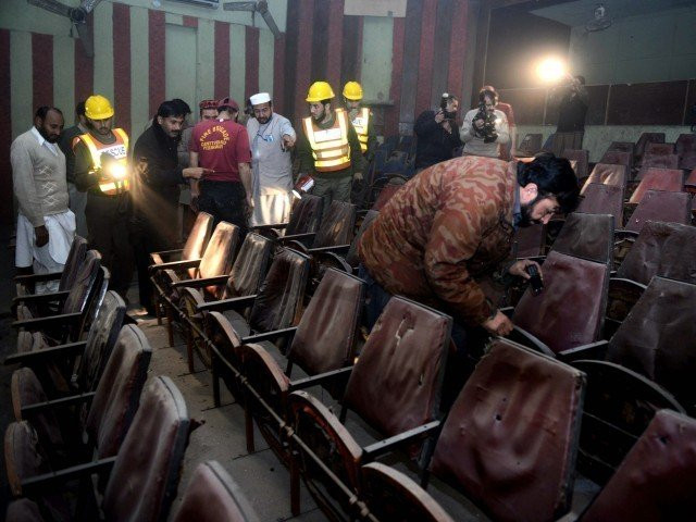 volunteers and security officials investigate the cinema after the attack photo afp file volunteers and security officials investigate the cinema after the attack photo afp file