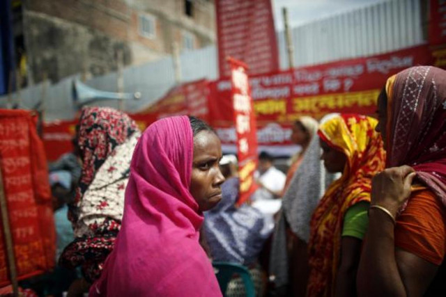 garment workers who survived the rana plaza building collapse take part in a protest to demand for compensation on the six month anniversary of the incident in front of the site in savar october 24 2013 photo reuters garment workers who survived the rana plaza building collapse take part in a protest to demand for compensation on the six month anniversary of the incident in front of the site in savar october 24 2013 photo reuters