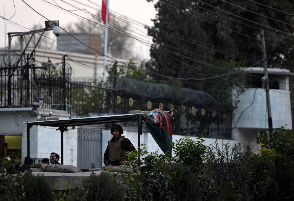 pakistani security personnel stand guard outside the iranian consulate following a suicide bomb attack in peshawar on february on february 24 2014 photo afp