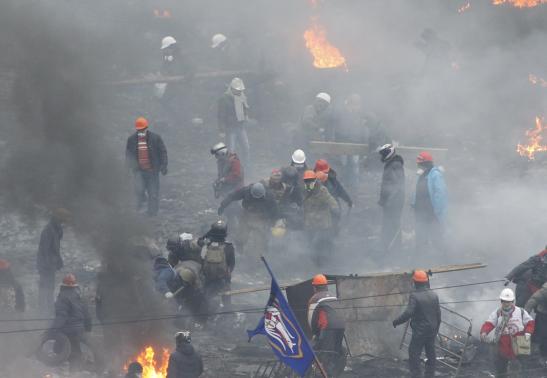 anti government protesters carry an injured man on a stretcher in independence square in kiev february 20 2014 photo reuters