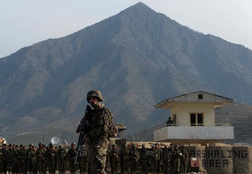 afghan national army ana soldiers stand at the forward base in nari district near an army outpost in kunar province on the border with pakistan on february 24 2014 photo afp