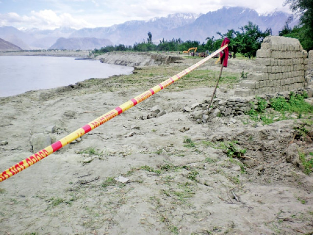 hoto is 20 metres above the indus river alongside the main road connecting gilgit with skardu flooding in last summer season swept away many dwellings built on the eroding land of the village photo express hoto is 20 metres above the indus river alongside the main road connecting gilgit with skardu flooding in last summer season swept away many dwellings built on the eroding land of the village photo express