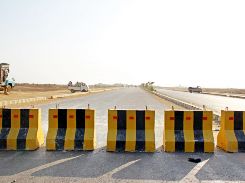 concrete barriers have been placed on the main road leading to do darya food street in dha phase viii photo ayesha mir express