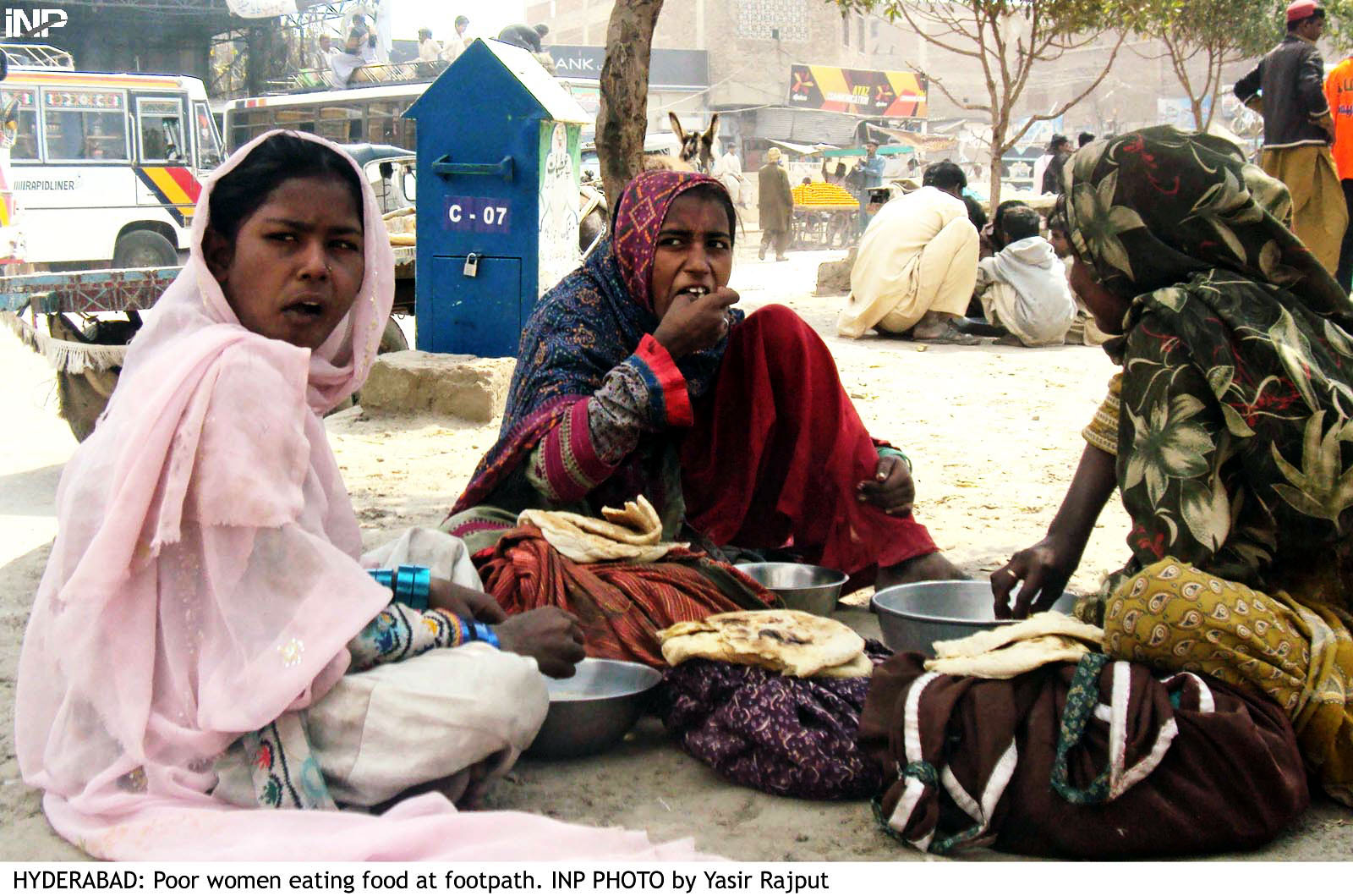 three women eat by the roadside in hyderabad on wednesday over 70 mothers in sindh are vitamin d deficient photo inp