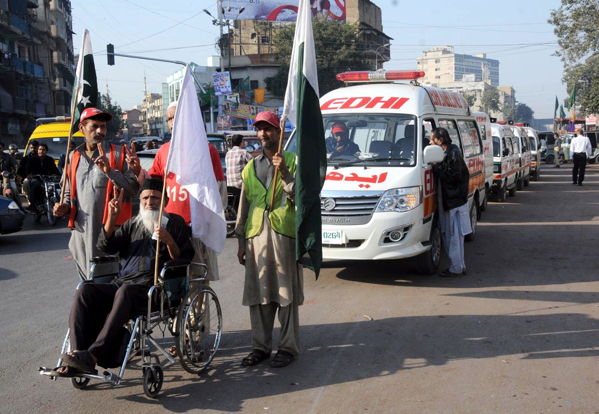 abdul sattar edhi accompanied by two volunteers during his walk for peace in karachi on wednesday photo mohammad azeem express