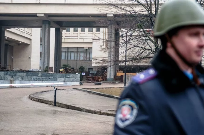 a police officer stands guard in front of the crimean parliament building in simferopol on february 27 2014 photo afp a police officer stands guard in front of the crimean parliament building in simferopol on february 27 2014 photo afp