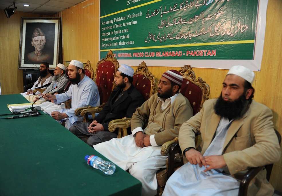 jan khan 3rd l the legal consultant for a group of pakistanis jailed in spain in 2009 speaks as he sits with detainees who were recently released and deported to pakistan during a press conference in islamabad on february 27 2014 photo afp