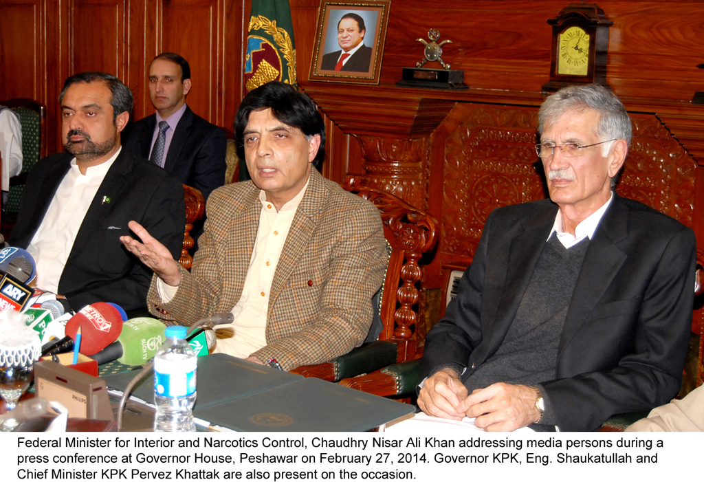 interior minister chaudhry nisar ali khan c addressing a press conference at governor house in peshawar along with cm k p pervez khattak r governor k p shaukatullah l photo pid