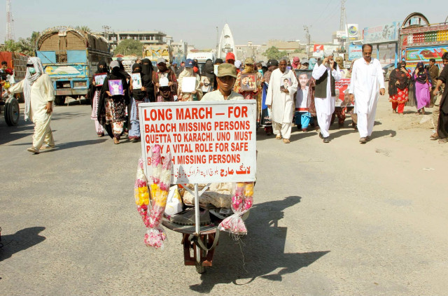 relatives of missing persons pass through a road during long march rally photo ppi relatives of missing persons pass through a road during long march rally photo ppi