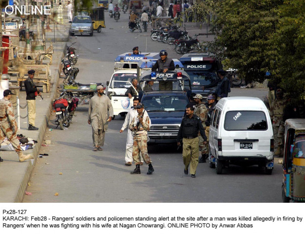 rangers and police officials gather after a ranger allegedly shot dead a man fighting with his wife near nagan chowrangi photo online rangers and police officials gather after a ranger allegedly shot dead a man fighting with his wife near nagan chowrangi photo online
