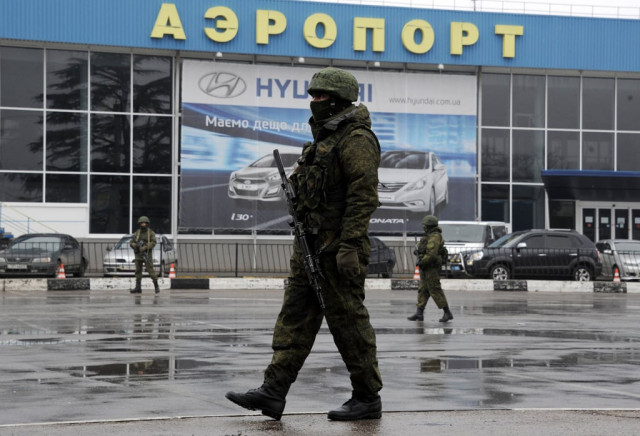 unidentified armed men patrol outside of simferopol airport on february 28 2014 photo afp unidentified armed men patrol outside of simferopol airport on february 28 2014 photo afp