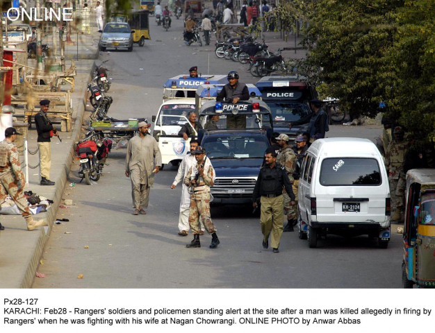 rangers and police officials gather after a ranger allegedly shot dead a man fighting with his wife near nagan chowrangi photo online