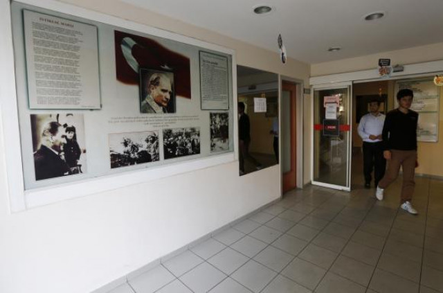 students walk past photographs of modern turkey 039 s secular founder mustafa kemal ataturk hanging on a wall at a university in turkey photo reuters students walk past photographs of modern turkey 039 s secular founder mustafa kemal ataturk hanging on a wall at a university in turkey photo reuters