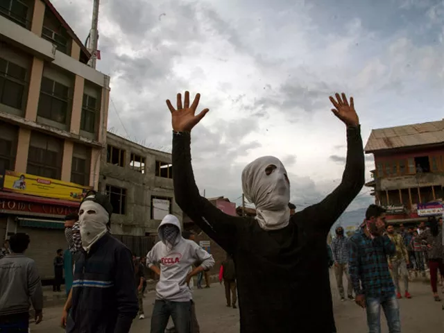 masked kashmiri muslims shout anti indian slogans as they attend the funeral of adil ahmed yadoo a civilian mowed down by an indian police armored vehicle during his funeral procession on may 5 2018 in srinagar photo getty masked kashmiri muslims shout anti indian slogans as they attend the funeral of adil ahmed yadoo a civilian mowed down by an indian police armored vehicle during his funeral procession on may 5 2018 in srinagar photo getty