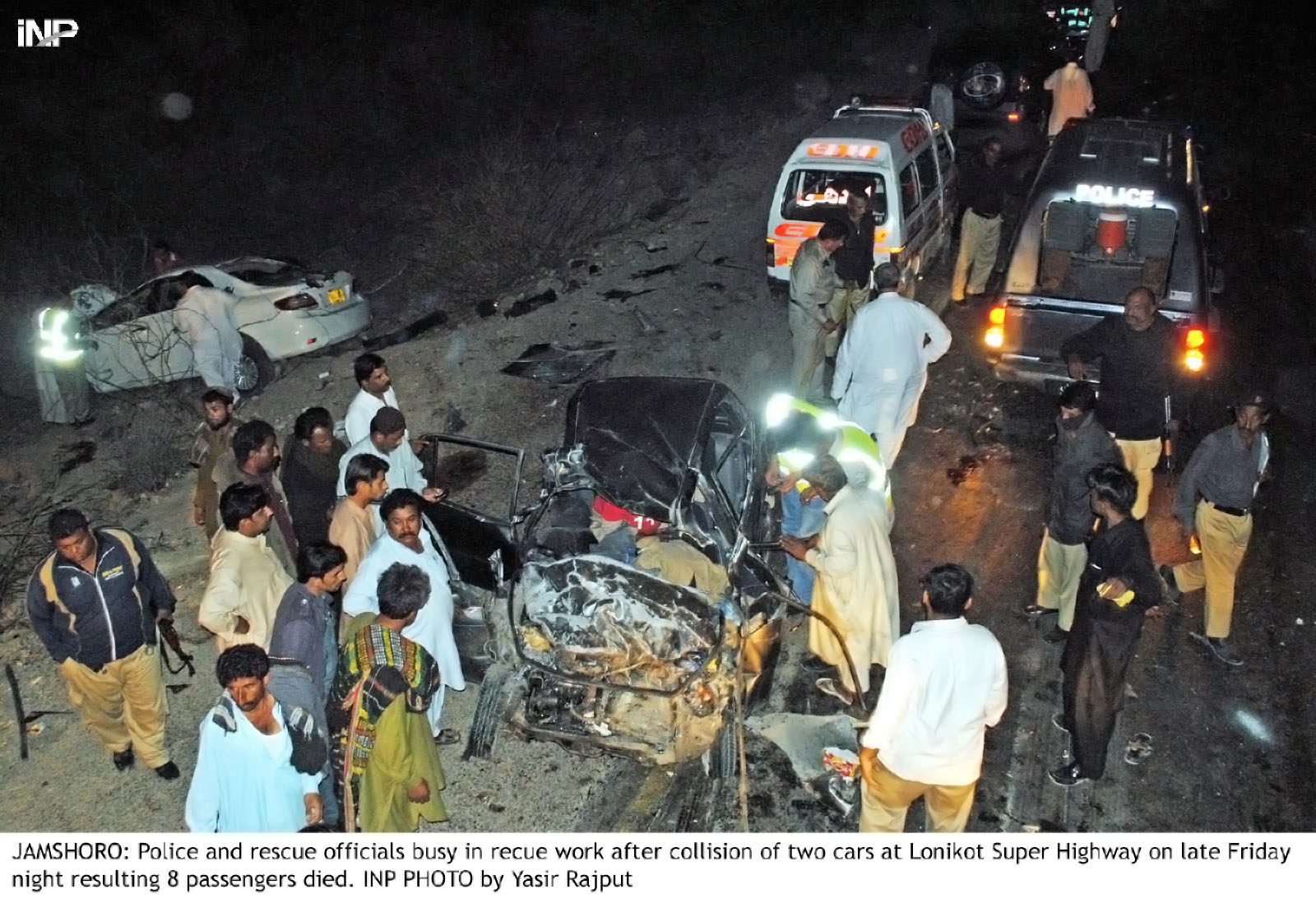 police and rescue officials gather at the spot of the collision between two cars near lonikot on super highway photo inp