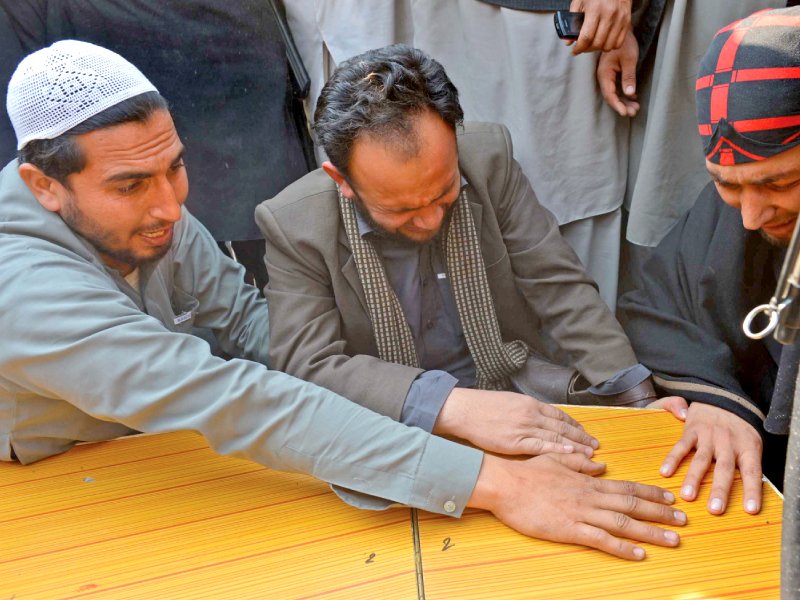 grief stricken relatives break down in tears over the death of a paramilitary soldier in a roadside blast in jamrud photo afp