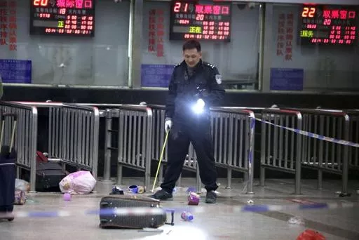 a chinese police investigator inspects the scene of an attack at the railway station in kunming southwest china 039 s yunnan province on march 2 2014 photo afp a chinese police investigator inspects the scene of an attack at the railway station in kunming southwest china 039 s yunnan province on march 2 2014 photo afp