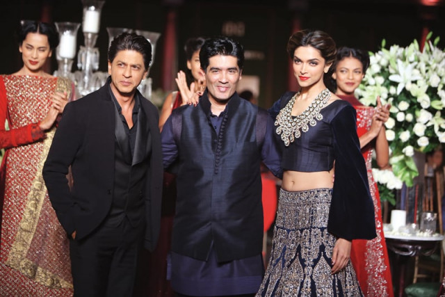 malhotra poses with bollywood bigshots shahrukh khan and deepika padukone at pcj delhi couture week 2013 photos file malhotra poses with bollywood bigshots shahrukh khan and deepika padukone at pcj delhi couture week 2013 photos file