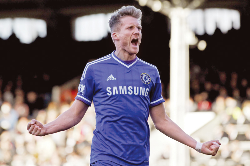 schurrle scored a hat trick as the premier league leaders won 3 1 at fulham on saturday leaving chelsea on top with 63 points from 28 games photo afp