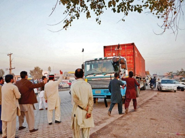 for nearly three months activists of pti and its coalition partners in the government held a sit in at hayatabad toll plaza and inspected trucks heading to afghanistan vehicles found to be carrying supplies for nato troops were not allowed to pass through photo file for nearly three months activists of pti and its coalition partners in the government held a sit in at hayatabad toll plaza and inspected trucks heading to afghanistan vehicles found to be carrying supplies for nato troops were not allowed to pass through photo file