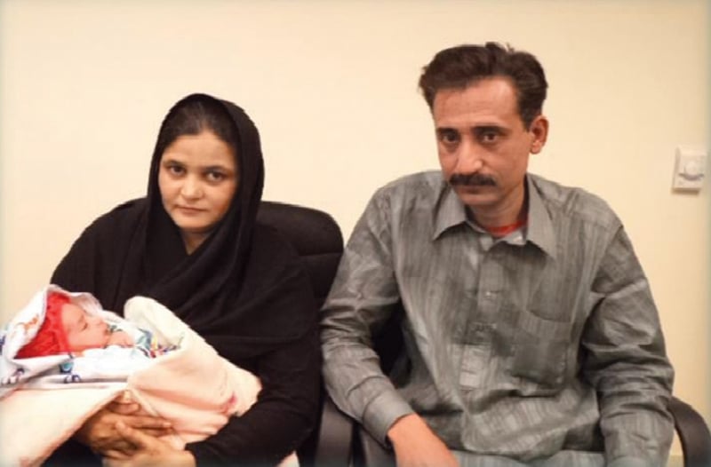 ahmed khan with his wife almas begum and their newborn child photo courtesy aman foundation