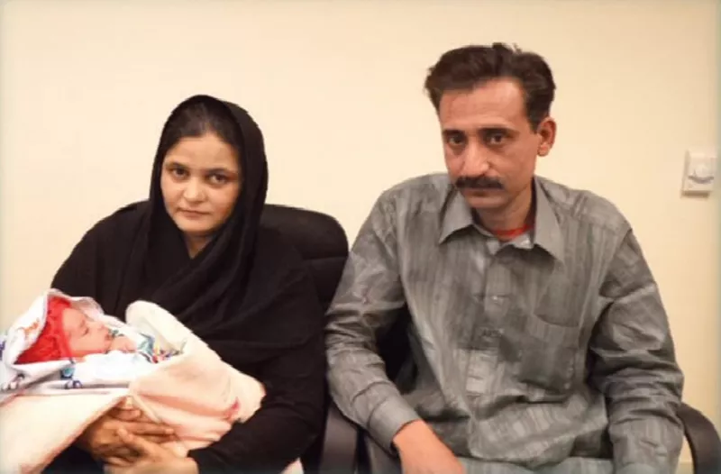ahmed khan with his wife almas begum and their newborn child photo courtesy aman foundation ahmed khan with his wife almas begum and their newborn child photo courtesy aman foundation