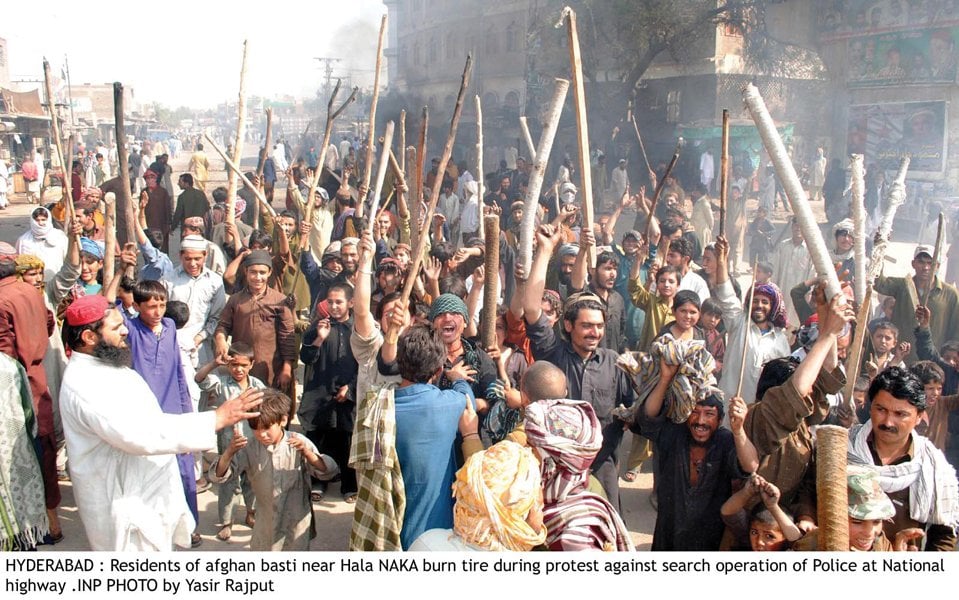 residents of afghan basti protesting at hala naka near hyderabad on national highway against police excesses during search operation for illegal immigrants photo inp