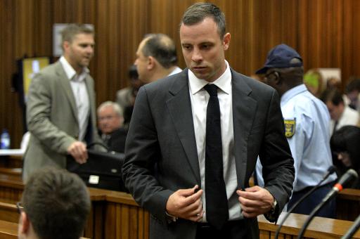 south african amputee olympian sprinter oscar pistorius arrives at the high court in pretoria on the opening day of his murder trial on march 3 2014 photo afp