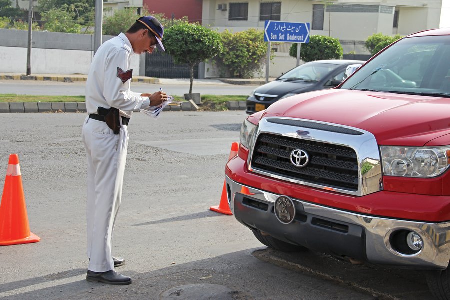 vehicles can be seen throughout karachi with government number plates but many of them are unregistered and do not pay taxes photo ayesha mir express