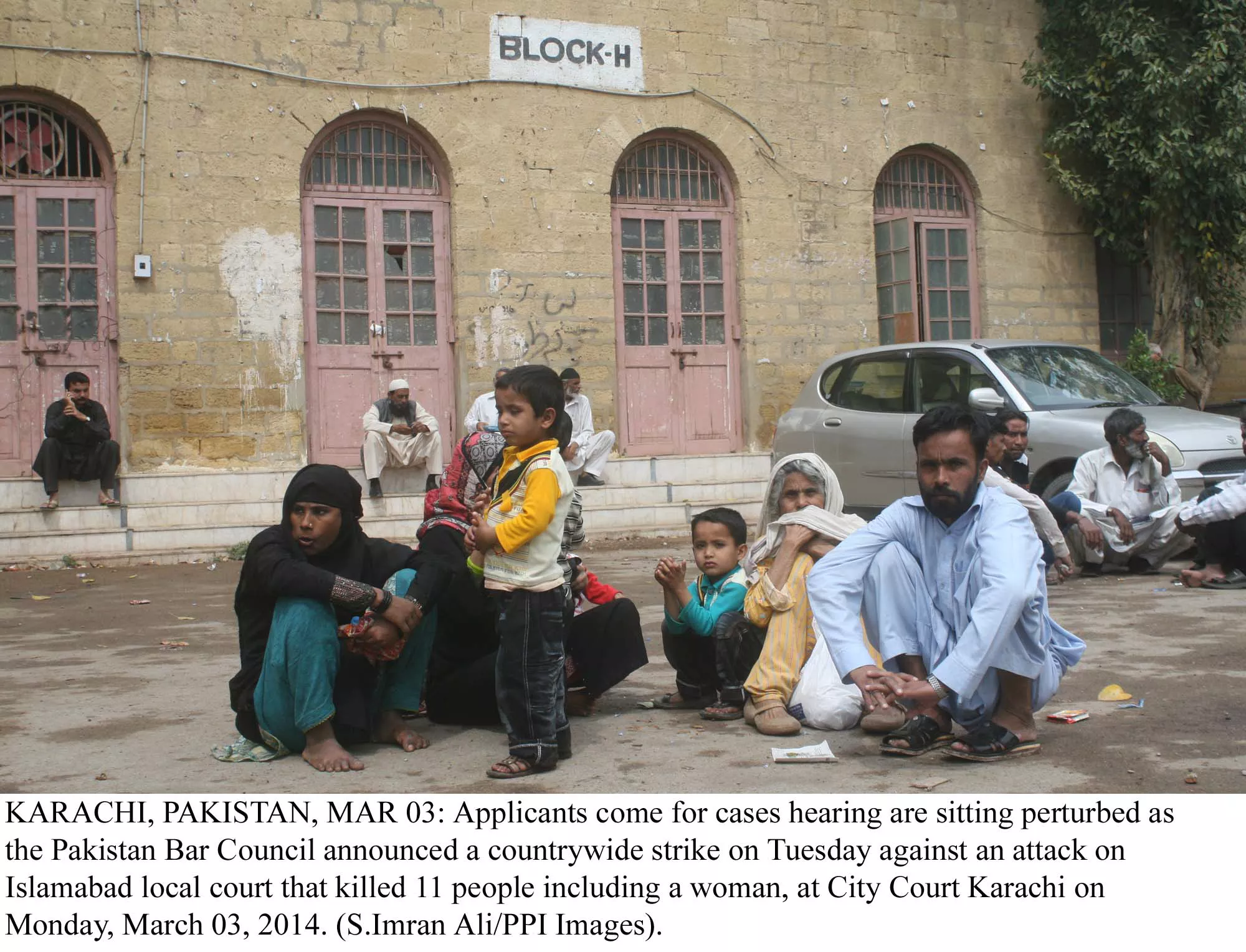a family waits outside a closed block h of the city court after the pakistan bar council announced a country wide strike in wake of attacks in islamabad lower courts on monday photo ppi a family waits outside a closed block h of the city court after the pakistan bar council announced a country wide strike in wake of attacks in islamabad lower courts on monday photo ppi