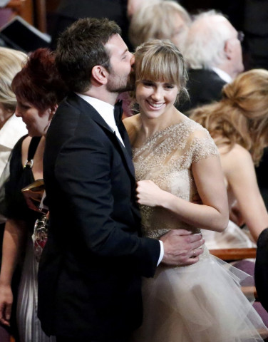 bradley cooper best supporting actor nominee for his role in quot american hustle and his girlfriend suki waterhouse share a moment before the show at the 86th academy awards in hollywood california photo reuters bradley cooper best supporting actor nominee for his role in quot american hustle and his girlfriend suki waterhouse share a moment before the show at the 86th academy awards in hollywood california photo reuters
