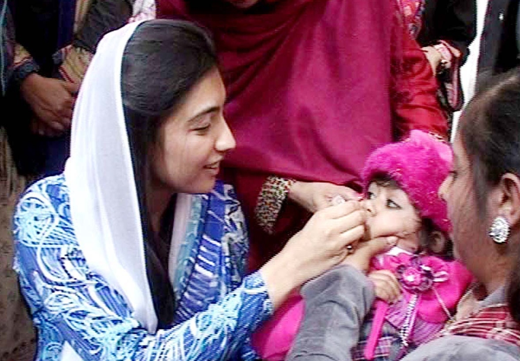 pakistan s ambassador for eradication of polio aseefa administering anti polio drops to a child at a school in karachi photo app