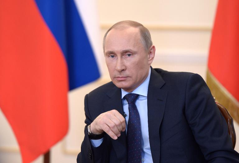 russian president vladimir putin looks on during a press conference in moscow on march 4 2014 photo afp