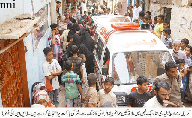 residents of a neighbourhood in lyari gather after the emergency services returned with the body of a man killed in gang war photo nni residents of a neighbourhood in lyari gather after the emergency services returned with the body of a man killed in gang war photo nni